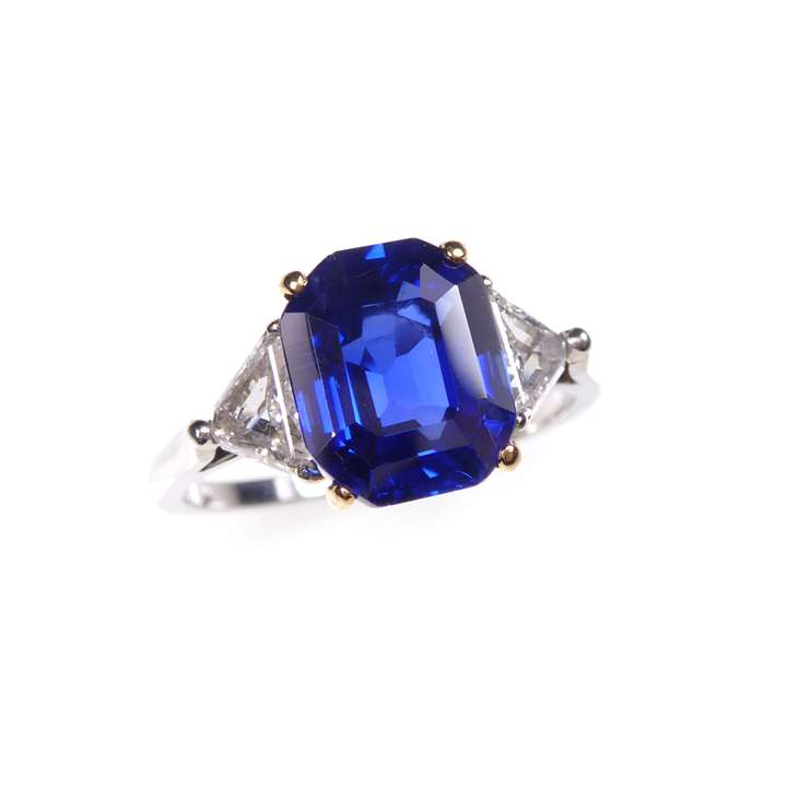 Single stone trap-cut rectangular sapphire and diamond ring